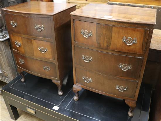 A pair of walnut bowfronted bedside chests, W.46cm